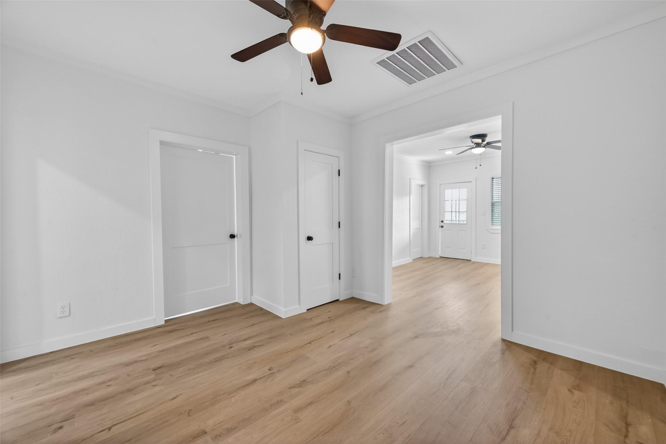 2202 Hutchins Street, Unit D Houston, TX 77003 - Photo 8 of 39 wooden floor in an empty room with a window