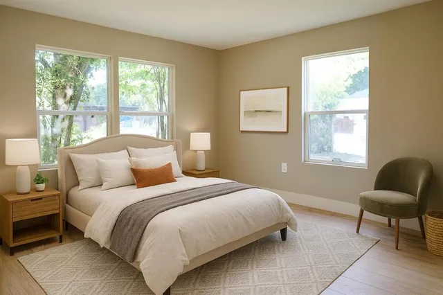 a bedroom with bed and a window