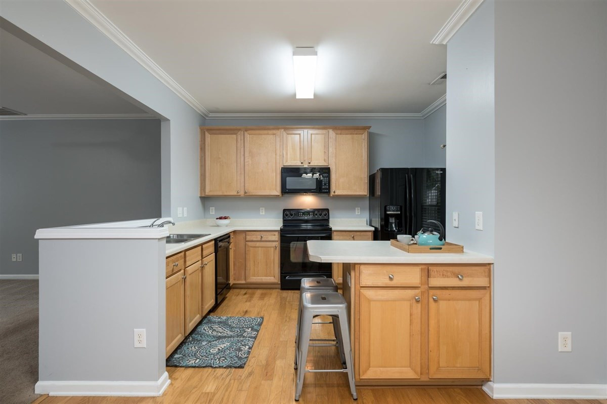 8311 Clasara Circle Raleigh, NC 27613 - Photo 9 of 27 Beautiful kitchen boasts maple cabinets, plenty of counter space, island, and separate pantry. Kitchen