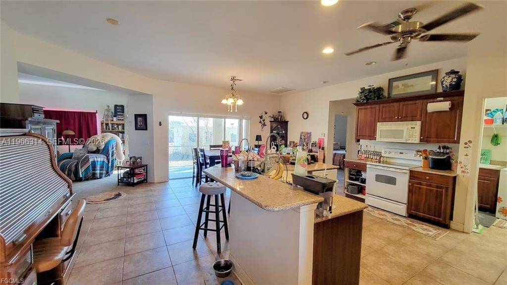 4529 Springview Circle LaBelle, FL 33935 - Photo 4 of 11 a view of a kitchen and a dining table with chairs