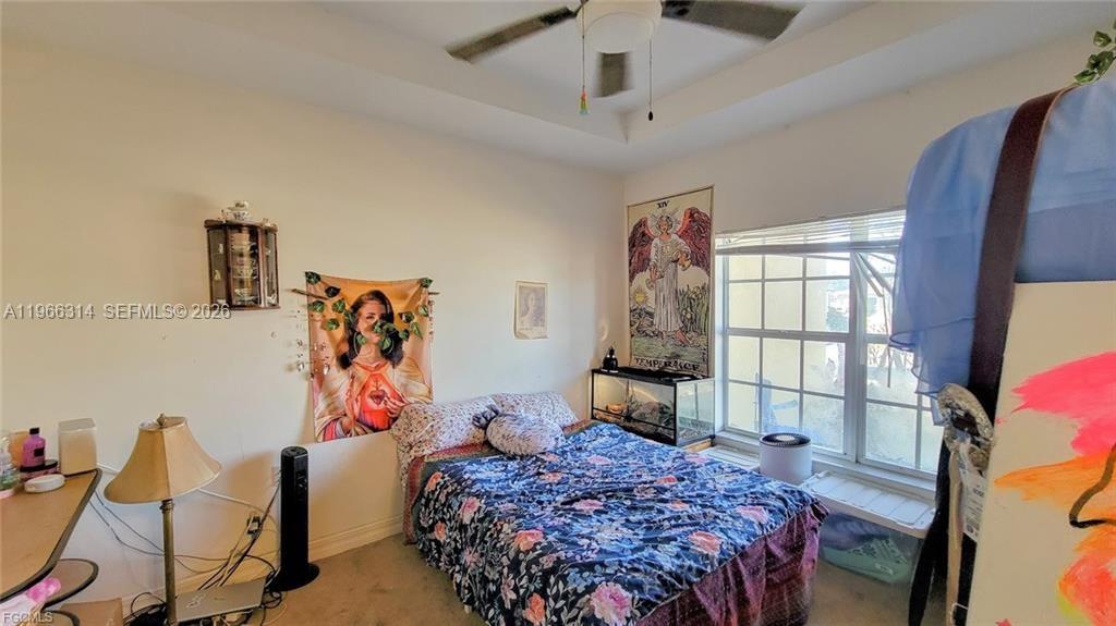 4529 Springview Circle LaBelle, FL 33935 - Photo 9 of 11 a bedroom with a bed and a window