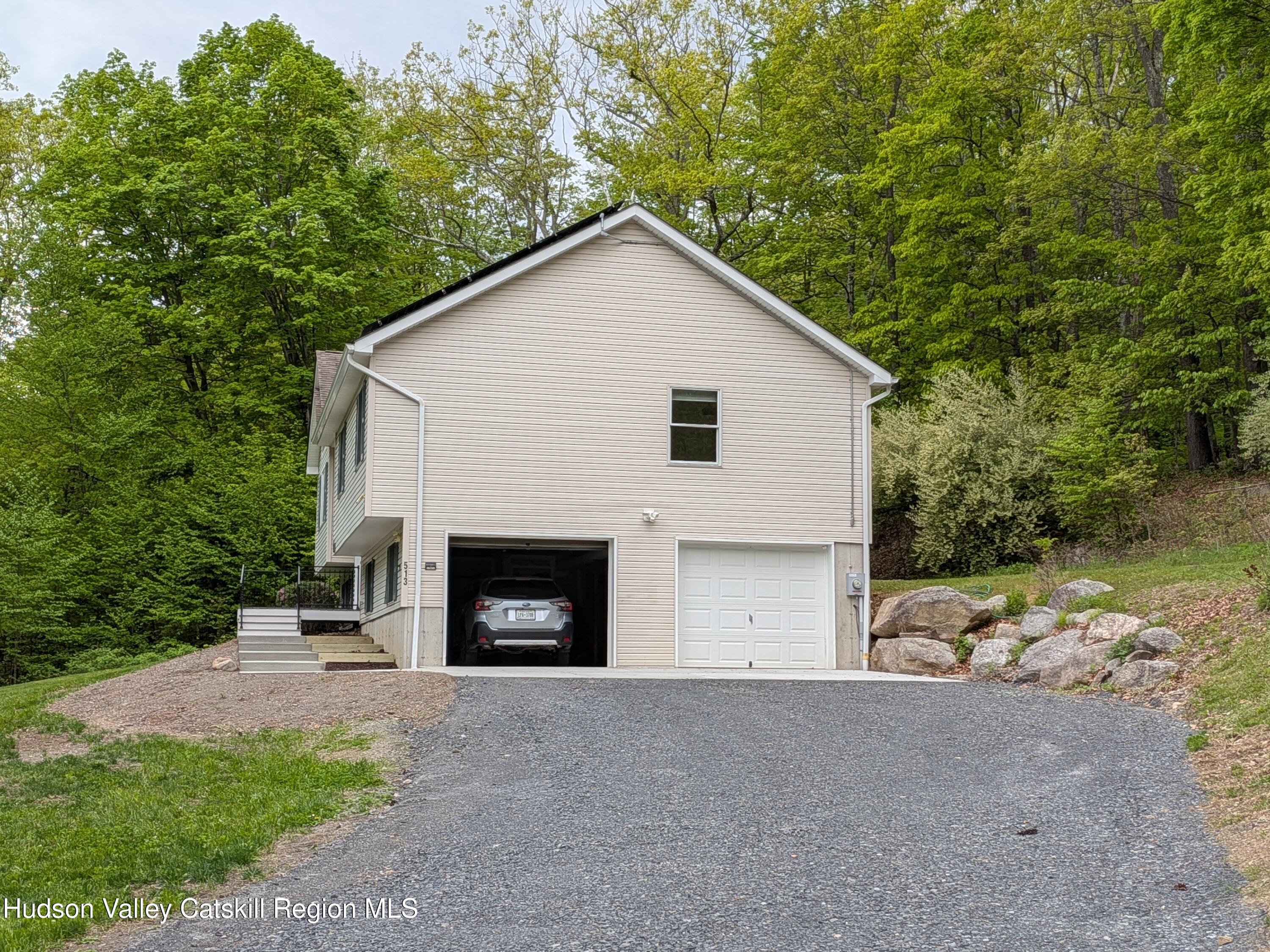 513 South Mountain Road Gardiner, NY 12525 - Photo 4 of 63 a view of a house with a yard and garage