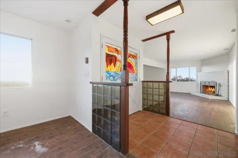 a view of kitchen with refrigerator and window