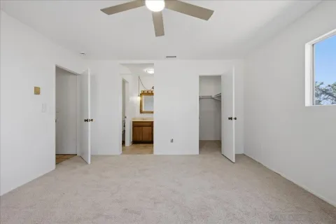 an empty room with fan