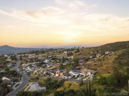 an aerial view of residential house and green space