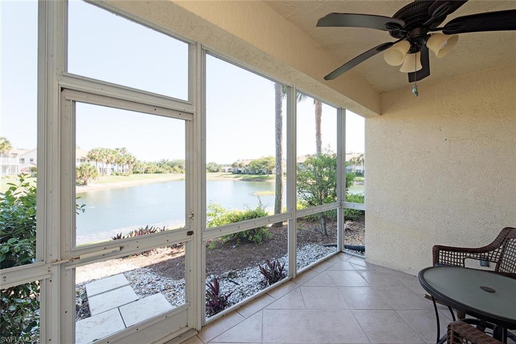 4960 Deerfield Way, Unit E103 Naples, FL 34110 - Photo 4 of 14 a view of a room with a large window