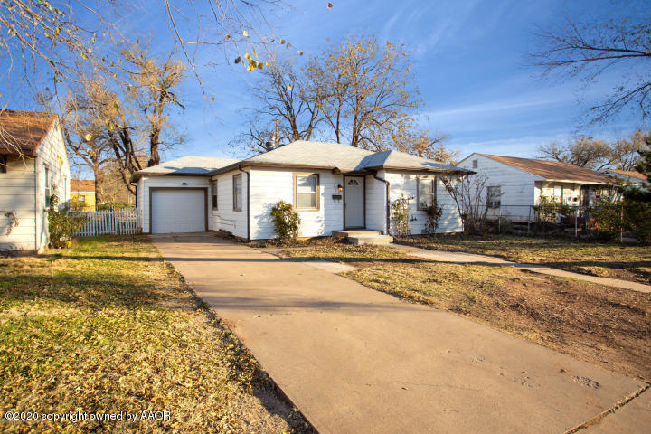 510 Southwest 45th Avenue Amarillo, TX 79110 - Photo 1 of 7 a front view of a house with a yard