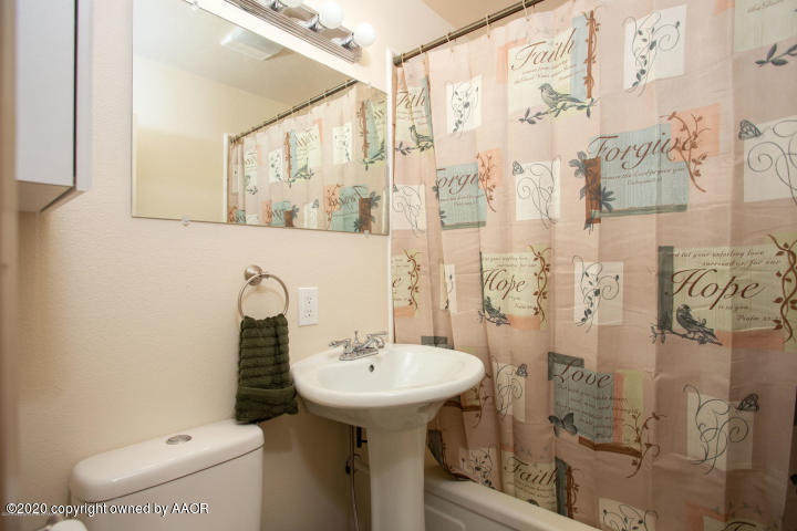 510 Southwest 45th Avenue Amarillo, TX 79110 - Photo 2 of 7 a bathroom with a sink toilet and shower