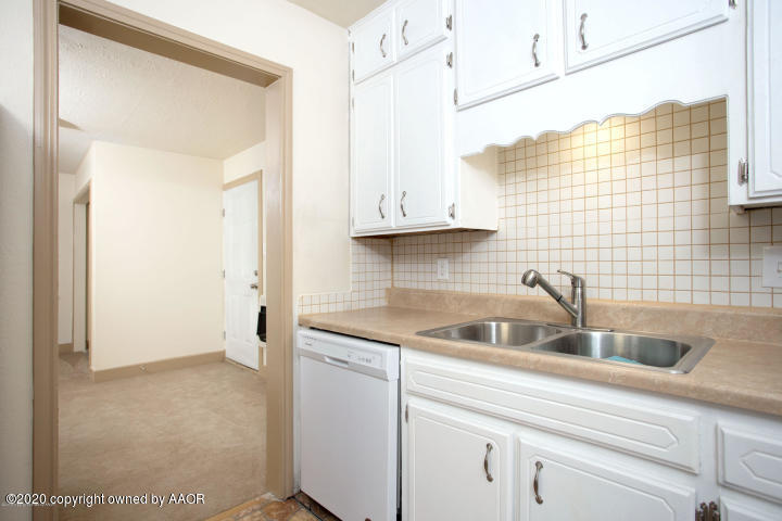510 Southwest 45th Avenue Amarillo, TX 79110 - Photo 4 of 7 a kitchen with a sink and cabinets