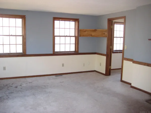 an empty room with windows