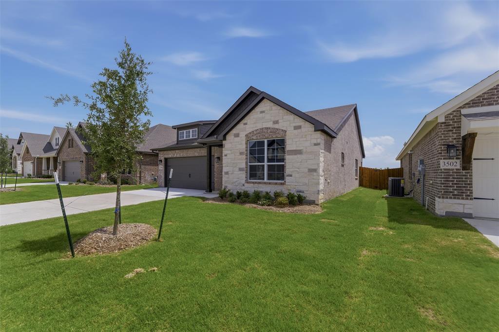 3504 Helena Street Gainesville, TX 76240 - Photo 2 of 19 Stone and brick exterior with dark trim accents
