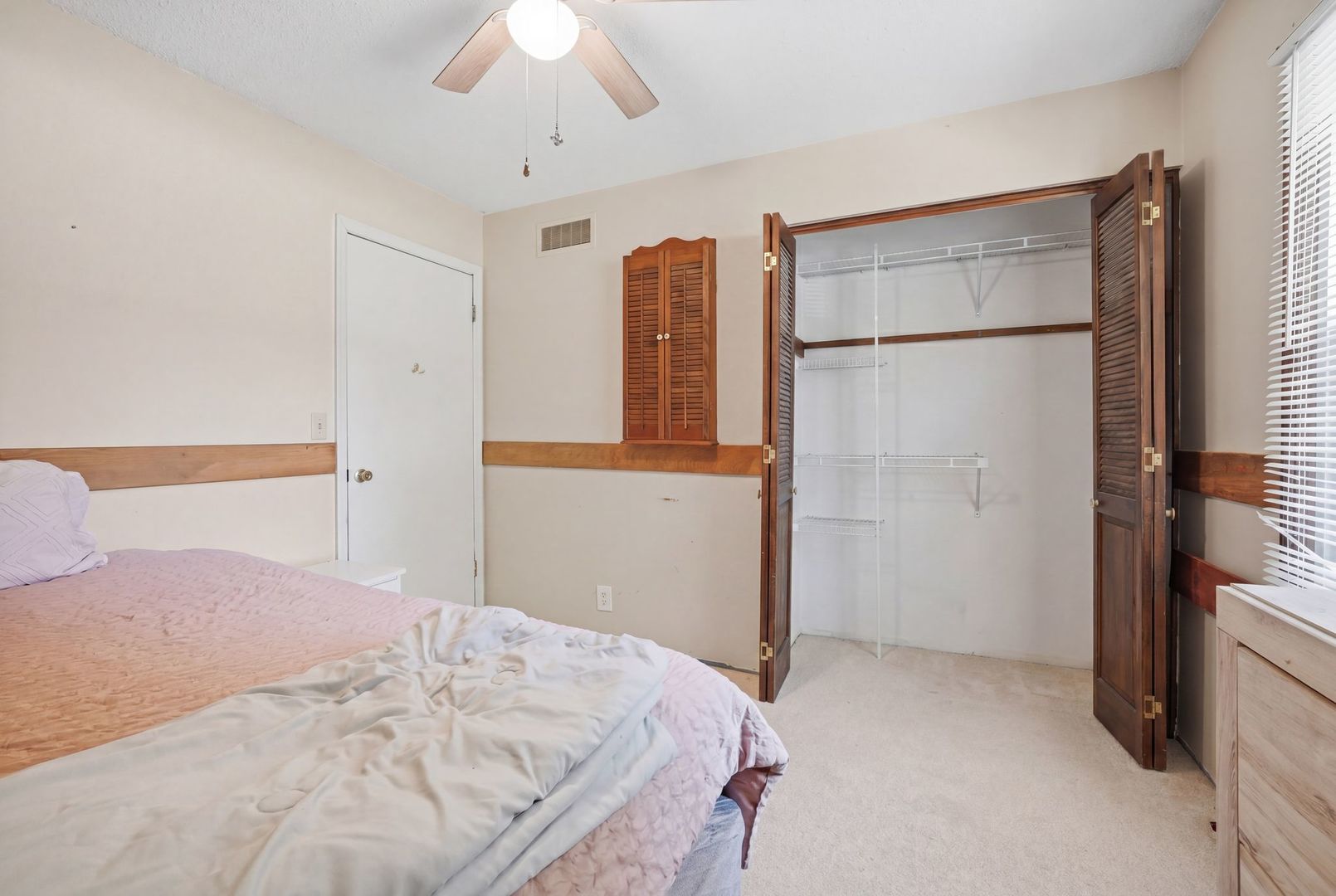 5645 Beebe Drive Rochelle, IL 61068 - Photo 19 of 43 a bedroom with a bed and a large mirror