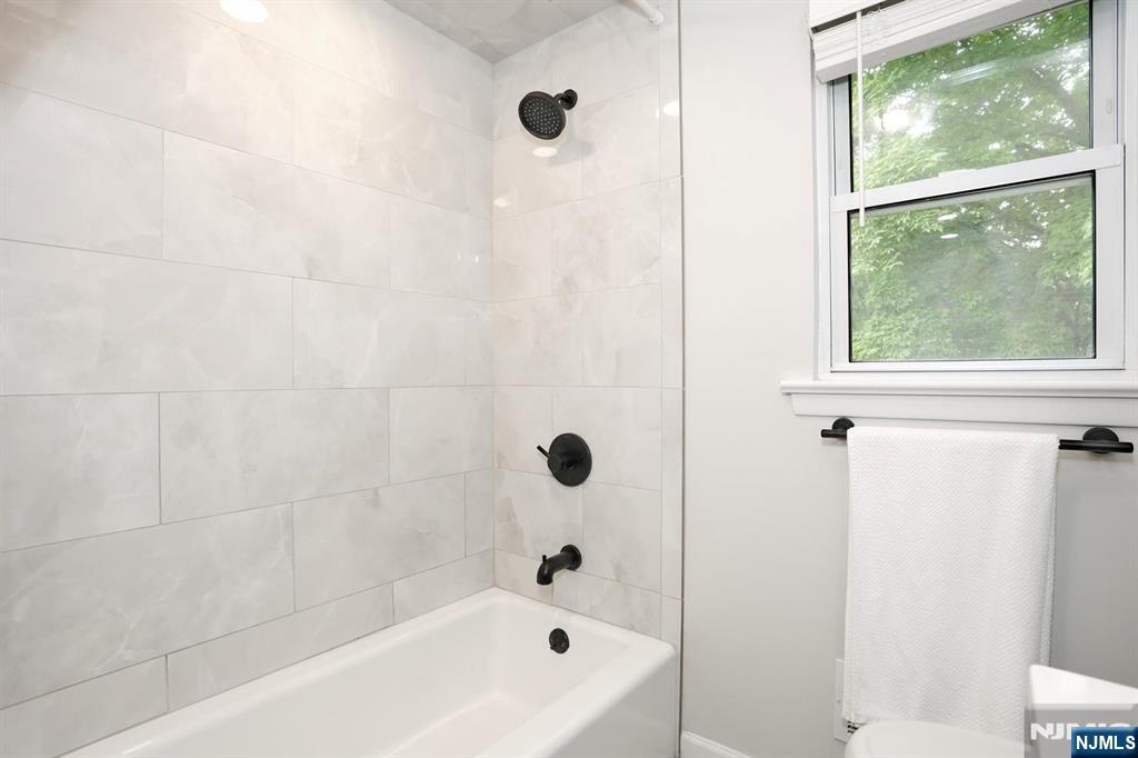 30 Brookfield Road Dumont, NJ 07628 - Photo 23 of 50 a bathroom with a bathtub