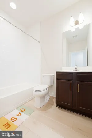 a bathroom with a sink a toilet and a bathtub