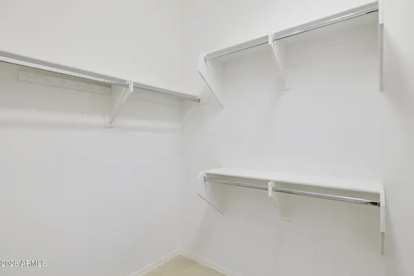 a spacious bathroom with a shower and a sink