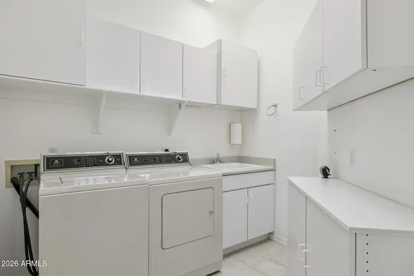 a bathroom with a sink a vanity and a mirror