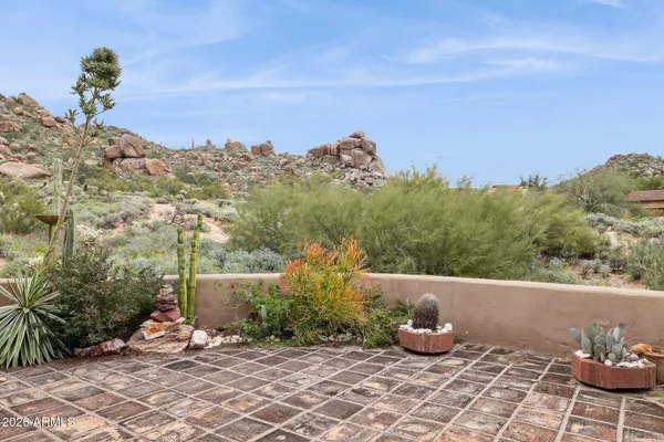 a view of a backyard with sitting area