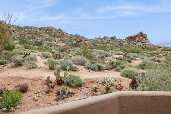 a terrace of a house with table and chairs
