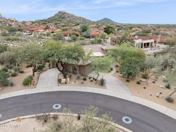 a view of a road with a mountain in the background