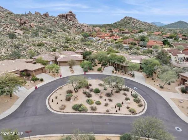 an aerial view of a residential houses with outdoor space