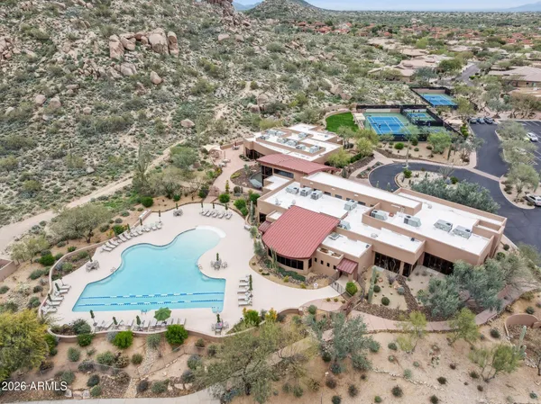 an aerial view of a house with a mountain view