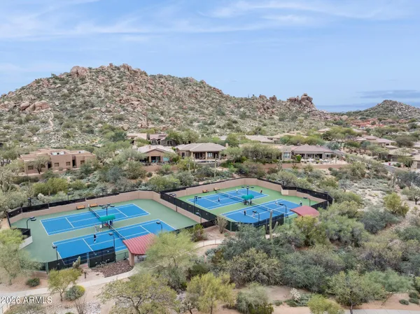 an aerial view of residential houses with outdoor space