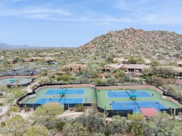 an aerial view of a house with a swimming pool