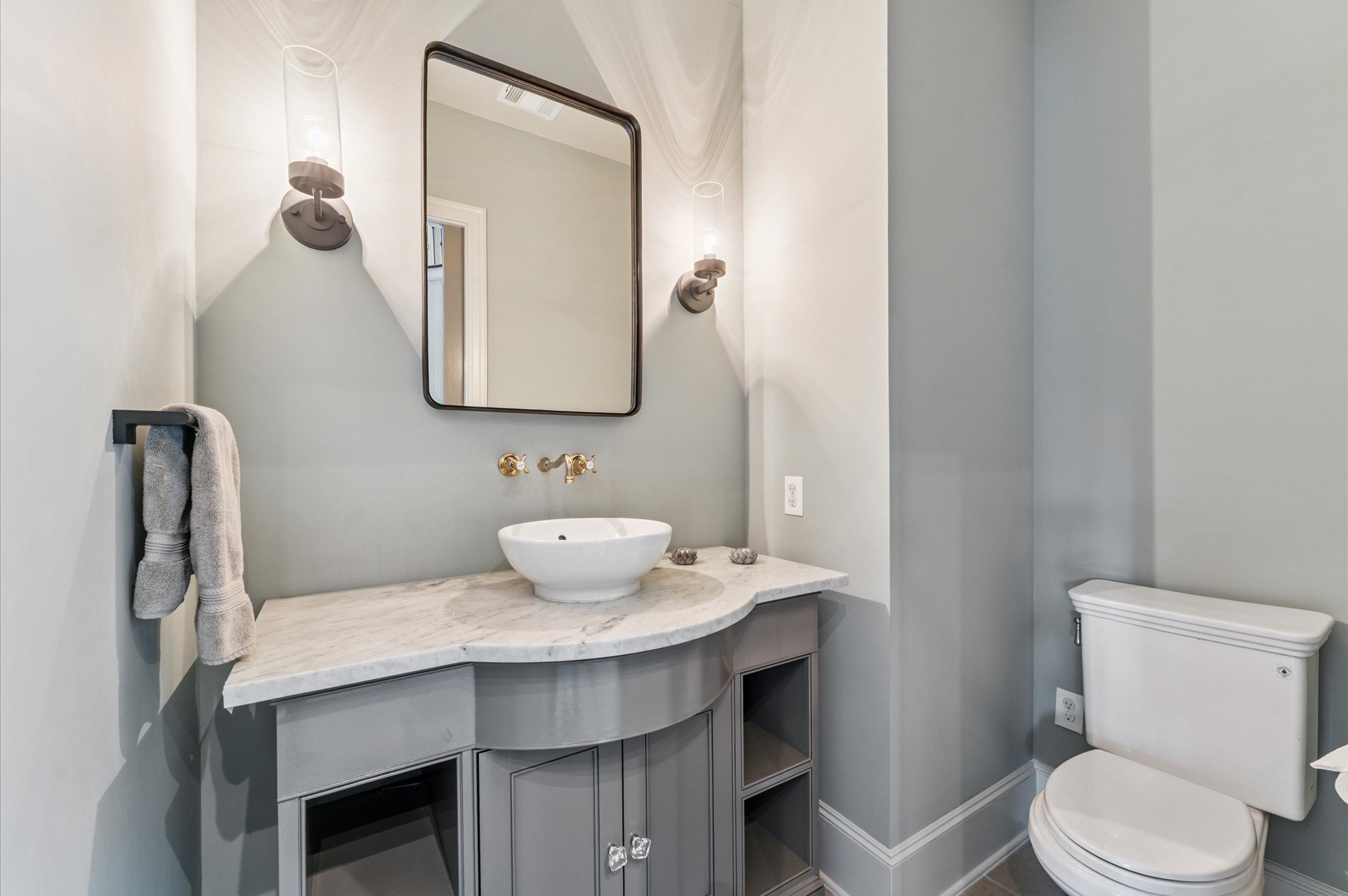 7 Marilane Street Houston, TX 77007 - Photo 18 of 45 a bathroom with a sink a toilet and mirror