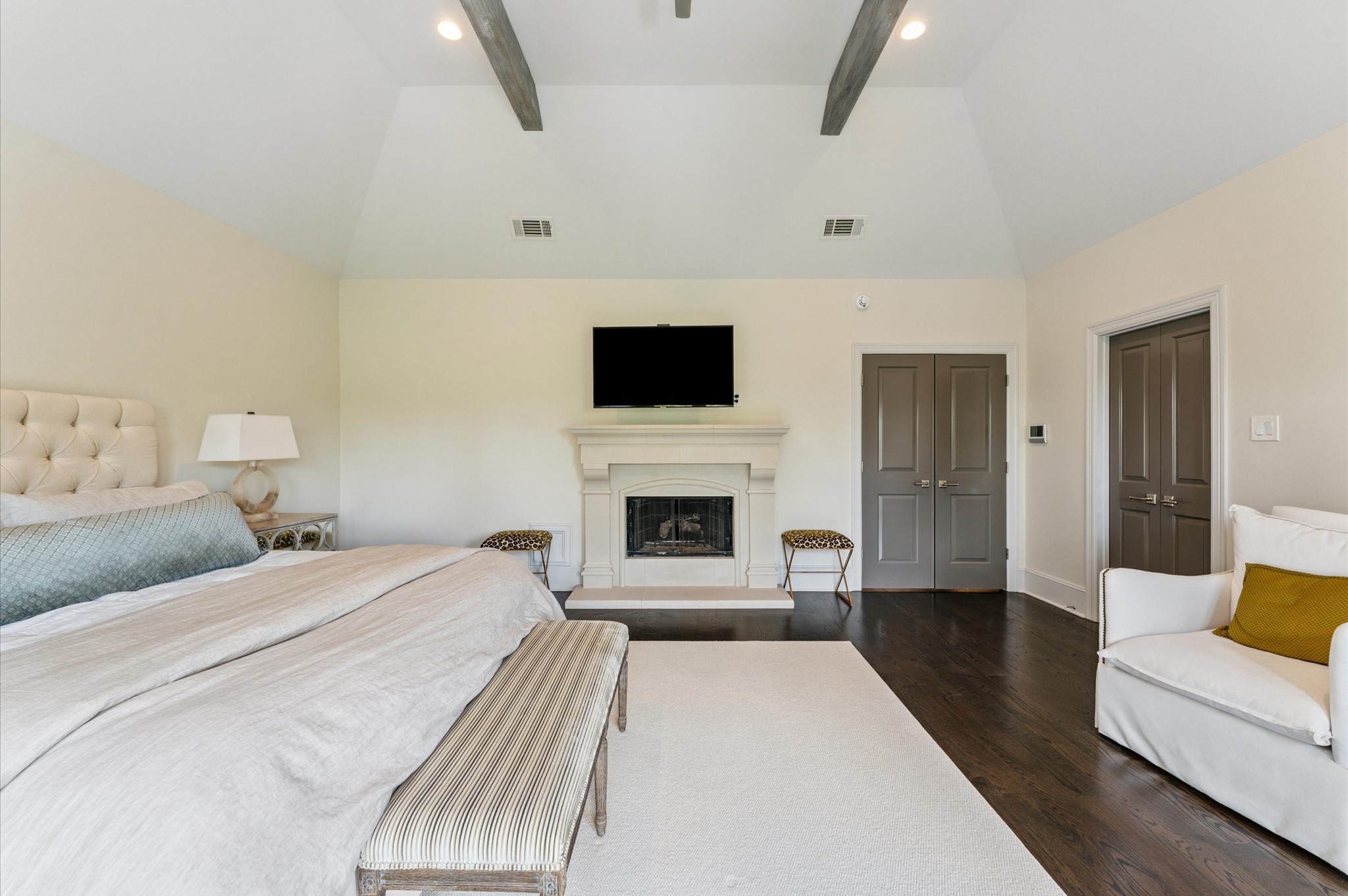 7 Marilane Street Houston, TX 77007 - Photo 22 of 45 a spacious bedroom with a bed and a fireplace