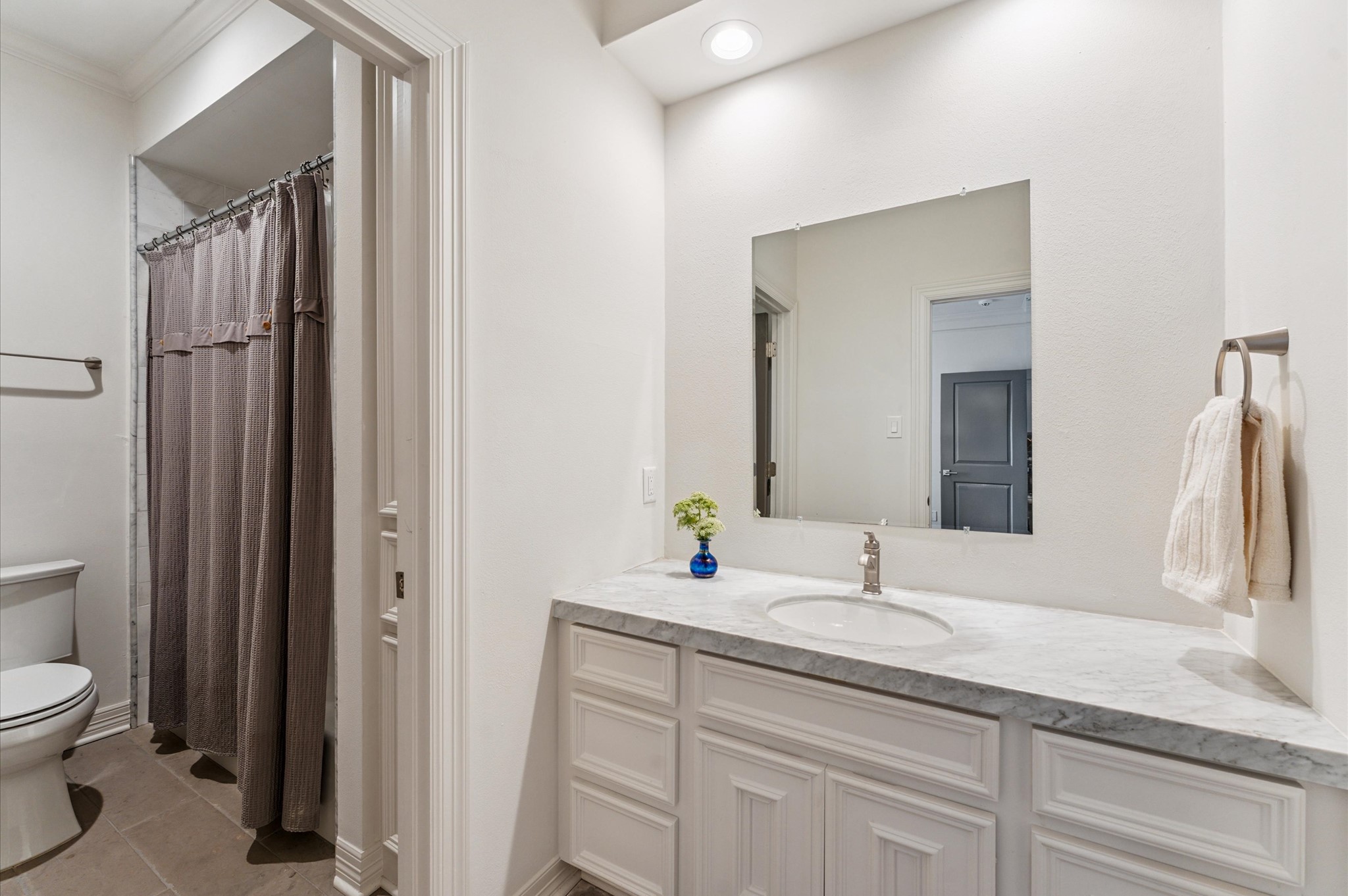 7 Marilane Street Houston, TX 77007 - Photo 28 of 45 a bathroom with a granite countertop sink toilet and shower