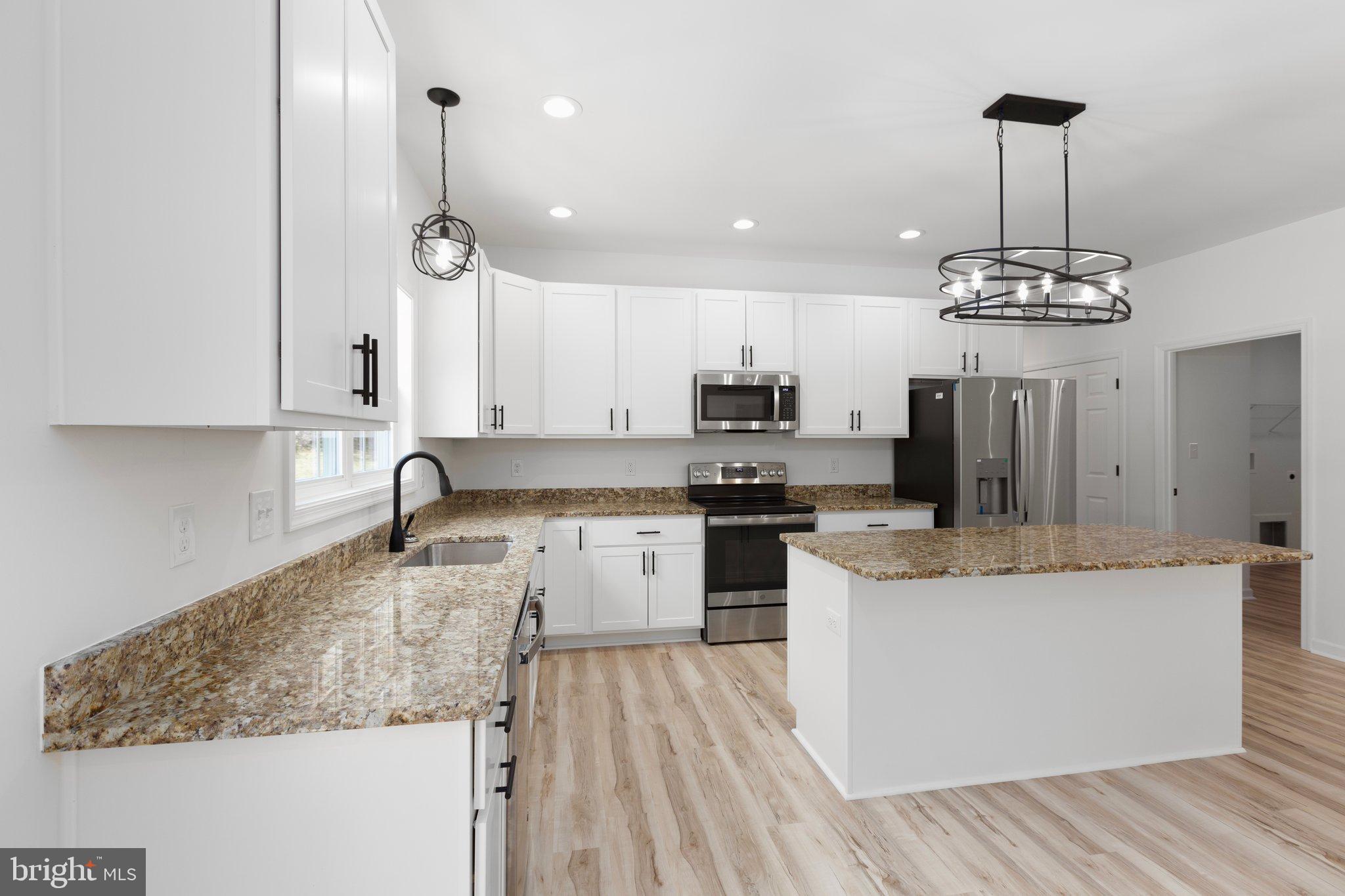 2180 Woodson Hollow Road Beaverdam, VA 23015 - Photo 11 of 32 Modern kitchen with elegant finishes.