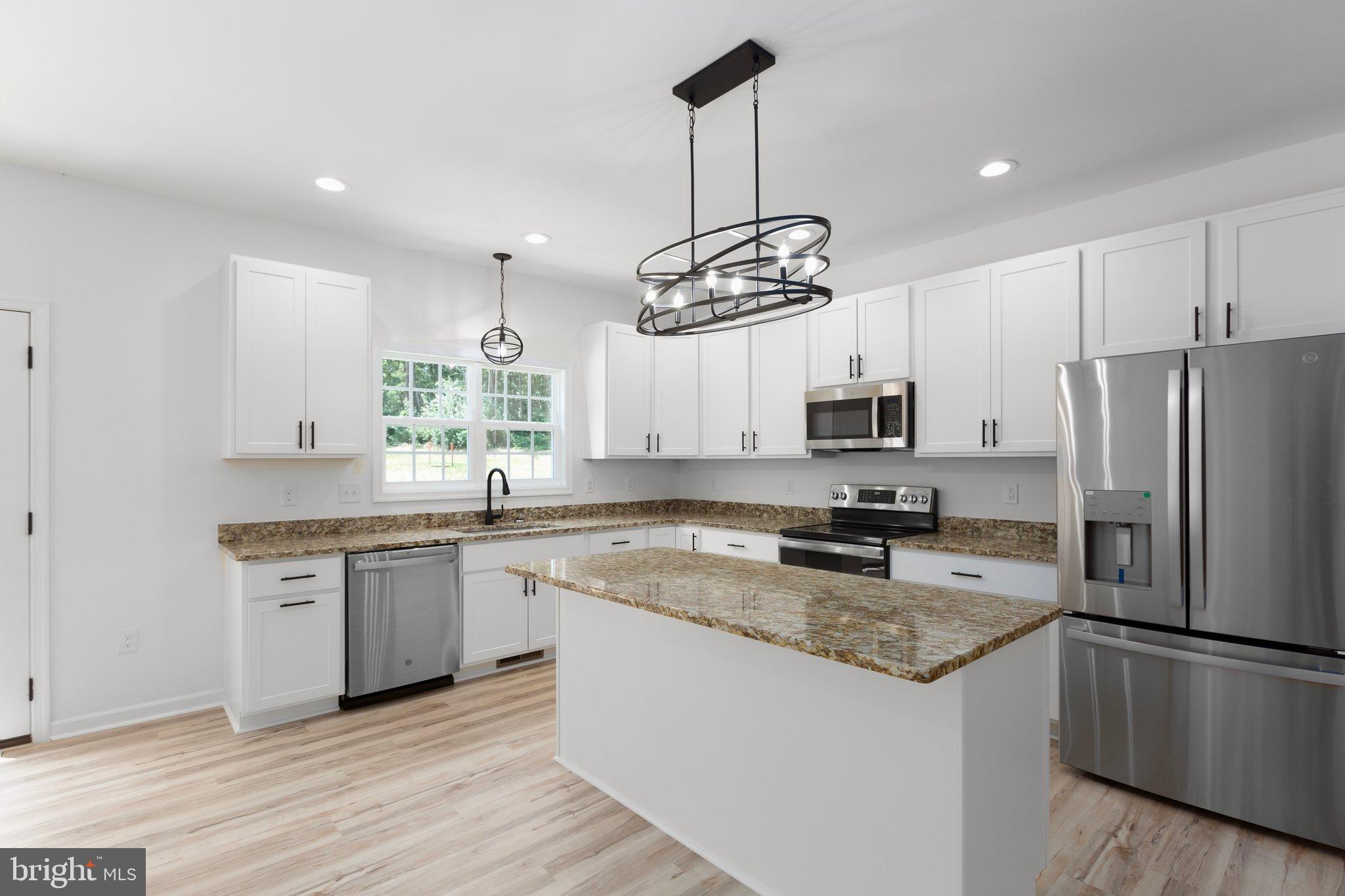 2180 Woodson Hollow Road Beaverdam, VA 23015 - Photo 12 of 32 Modern kitchen with sleek finishes.