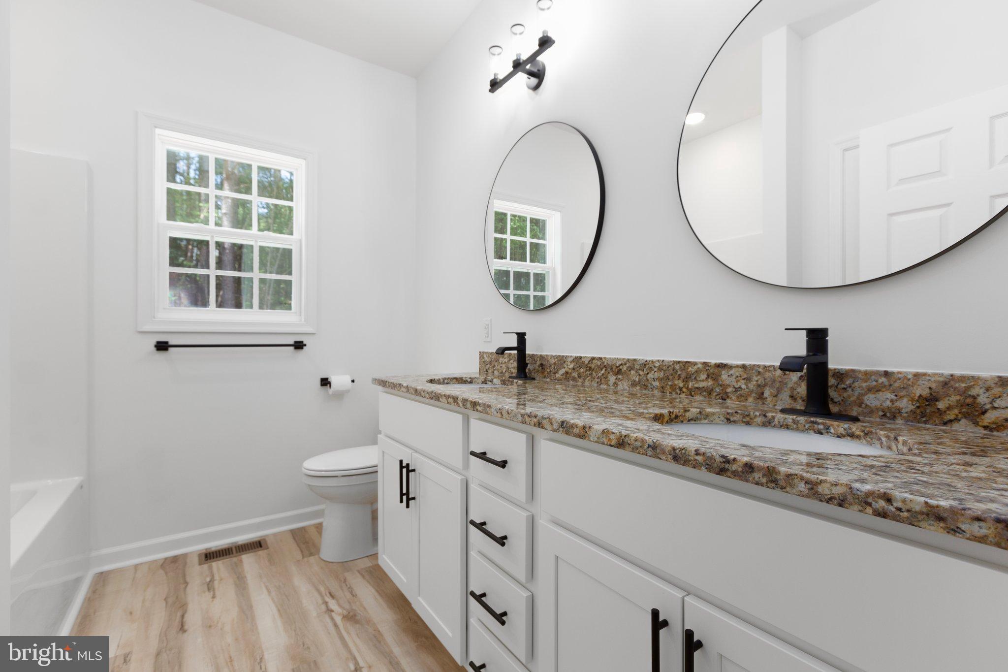 2180 Woodson Hollow Road Beaverdam, VA 23015 - Photo 21 of 32 Sleek modern bathroom 2 with elegant finishes.