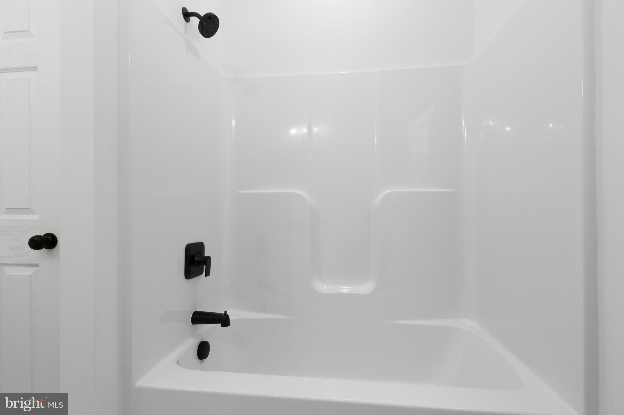 2180 Woodson Hollow Road Beaverdam, VA 23015 - Photo 22 of 32 Sleek, modern shower with elegant fixtures.