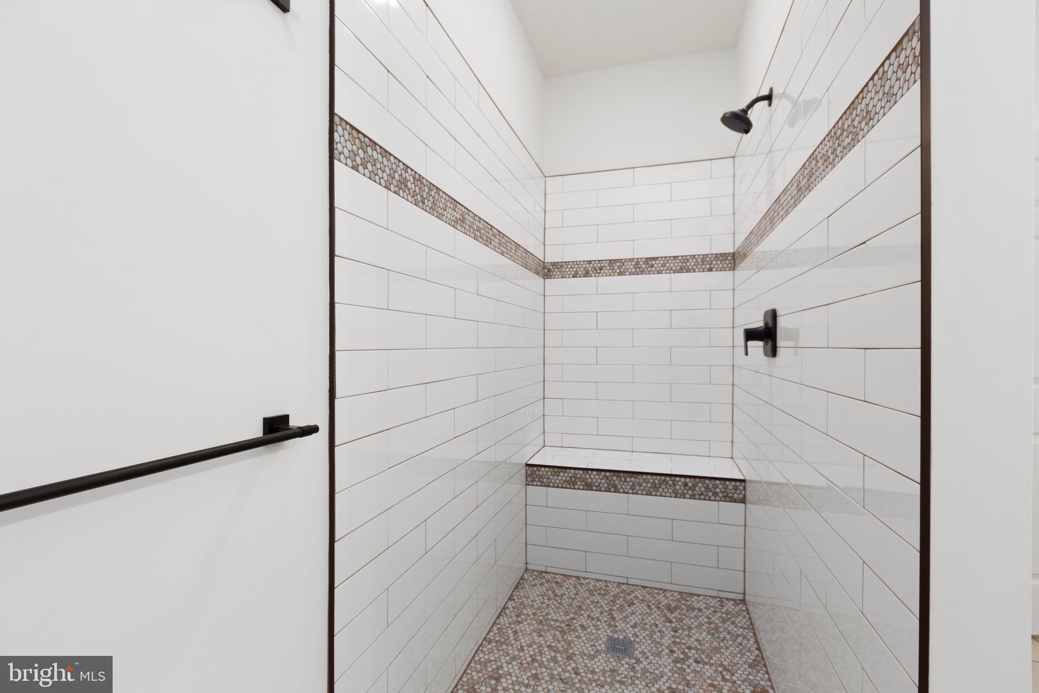 2180 Woodson Hollow Road Beaverdam, VA 23015 - Photo 31 of 32 Sleek, modern shower with elegant tile design.