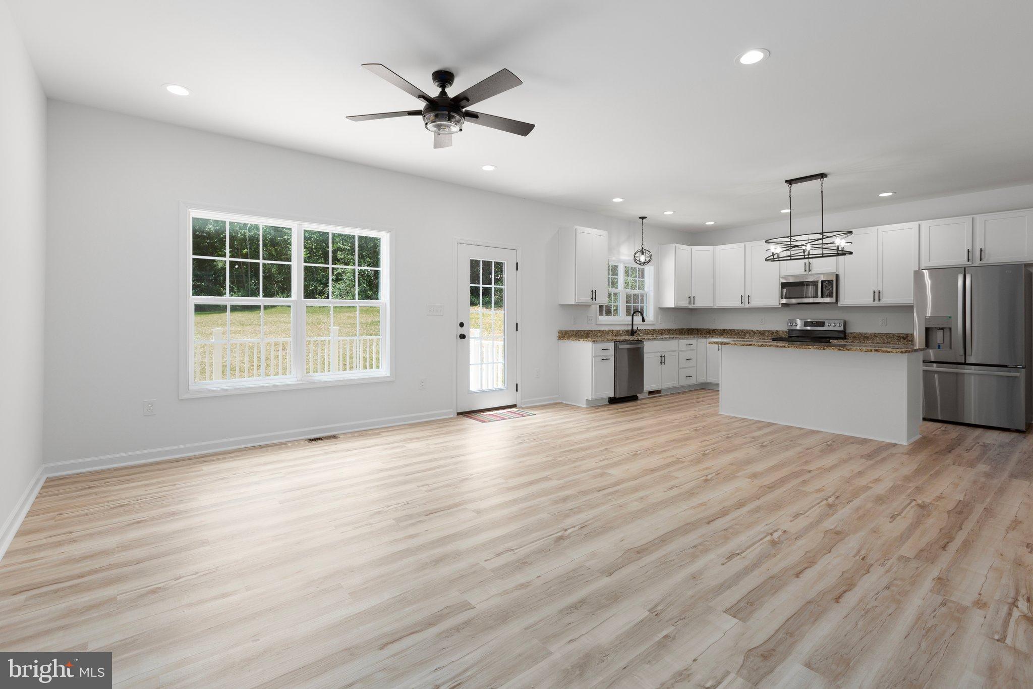 2180 Woodson Hollow Road Beaverdam, VA 23015 - Photo 8 of 32 Bright, open kitchen with modern finishes.