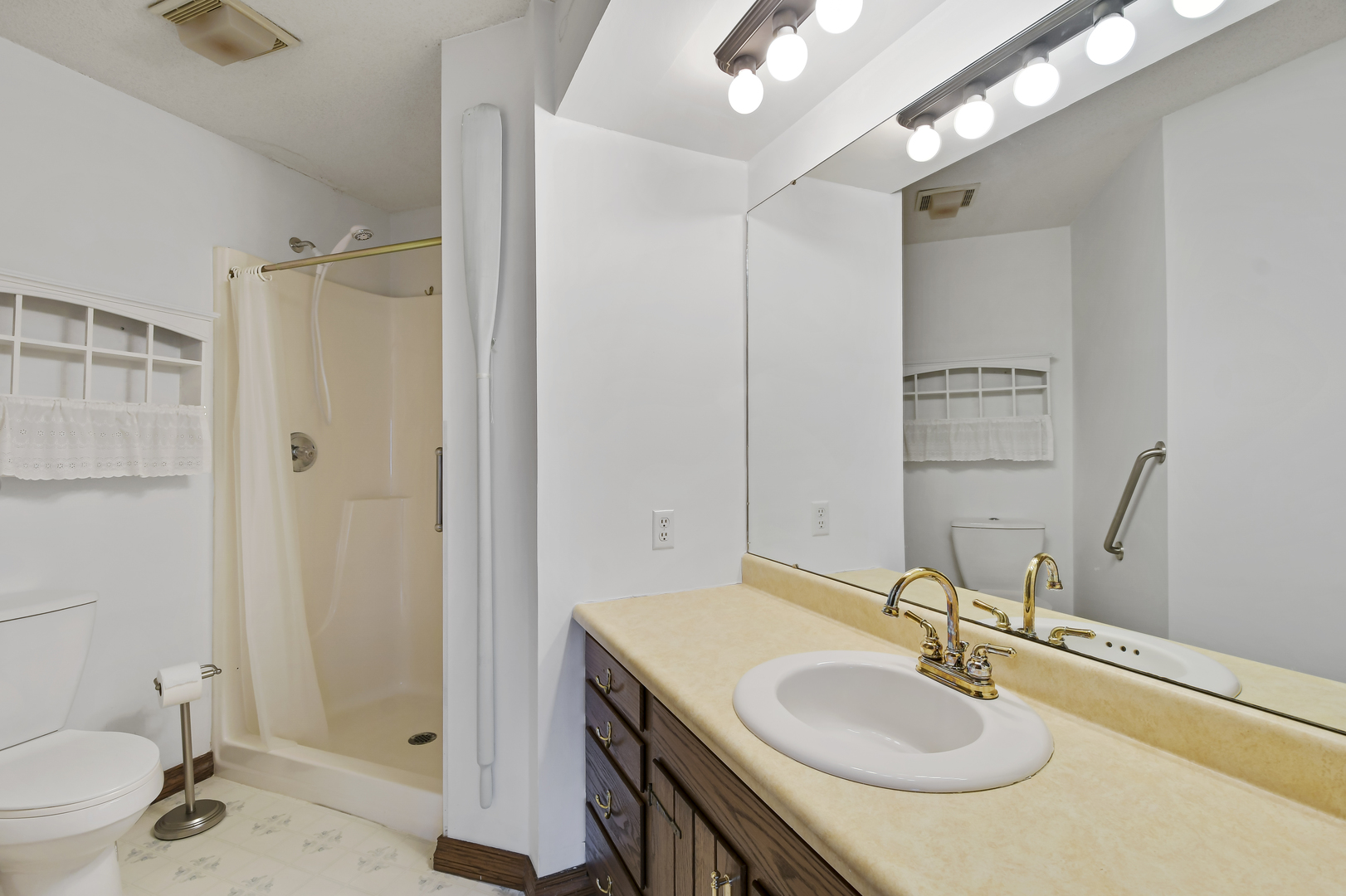 212 Spring Circle, Unit 212 Urbana, IL 61802 - Photo 13 of 22 a bathroom with a sink and a mirror