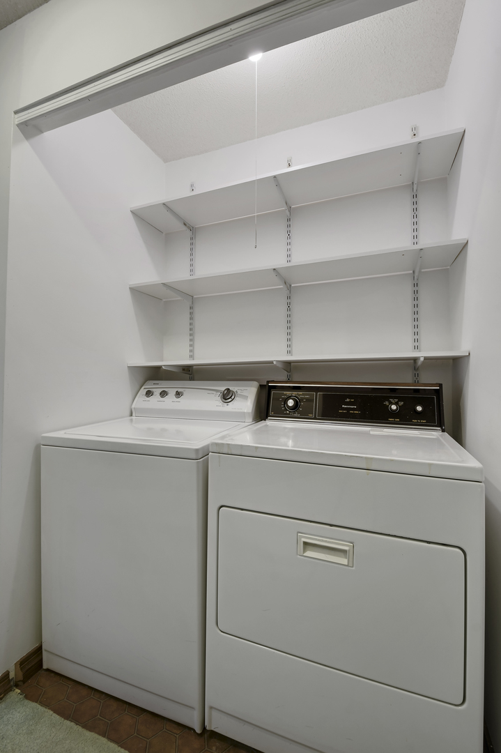 212 Spring Circle, Unit 212 Urbana, IL 61802 - Photo 14 of 22 a utility room with dryer and washer