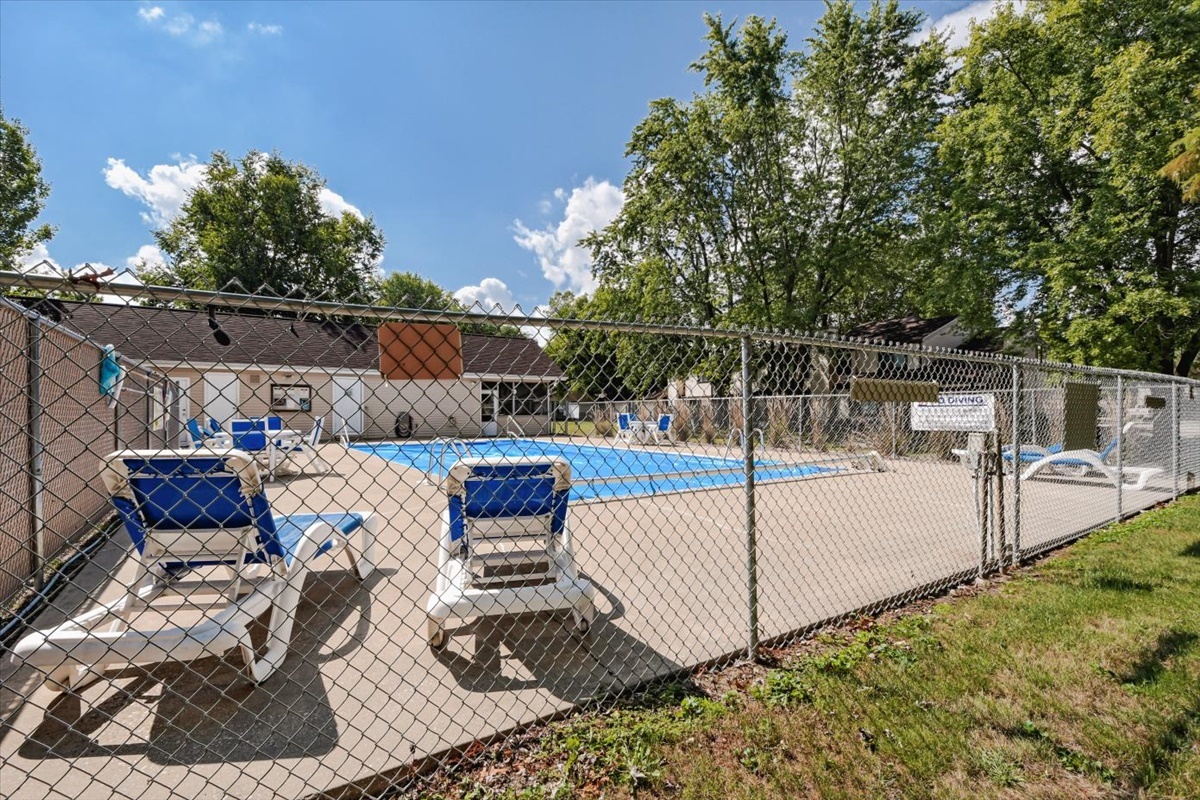212 Spring Circle, Unit 212 Urbana, IL 61802 - Photo 19 of 22 a view of a backyard with sitting area