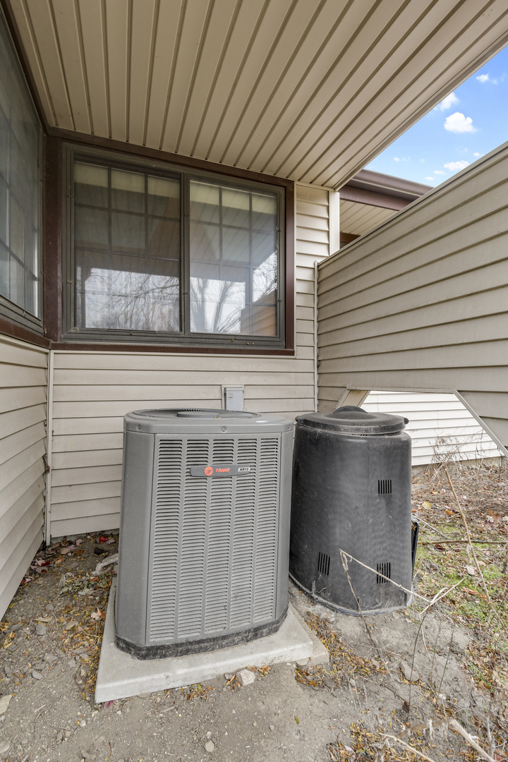 212 Spring Circle, Unit 212 Urbana, IL 61802 - Photo 20 of 22 a front view of a house with a window