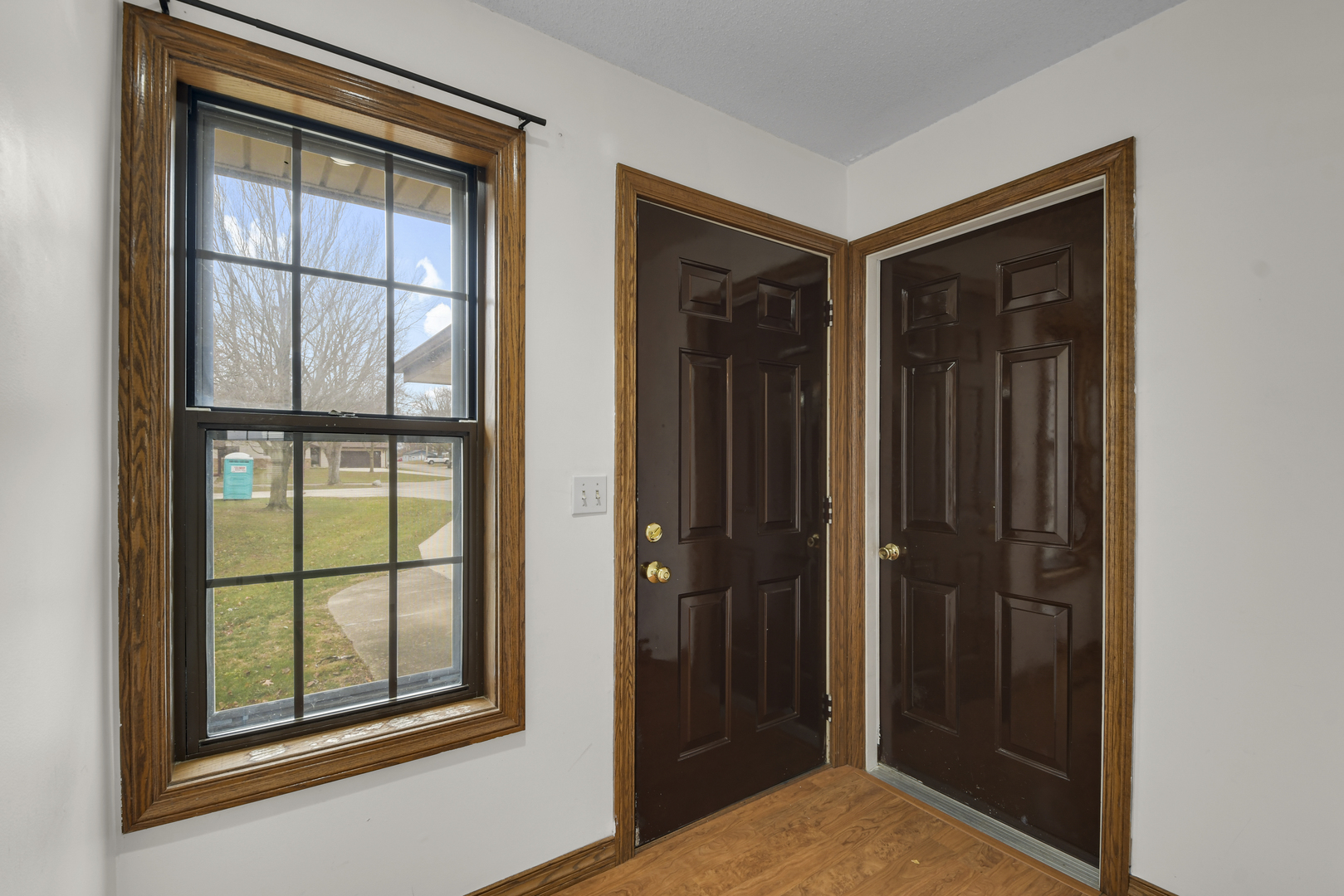 212 Spring Circle, Unit 212 Urbana, IL 61802 - Photo 3 of 22 wooden floor and windows in a room