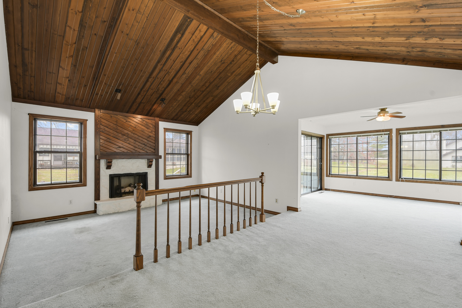 212 Spring Circle, Unit 212 Urbana, IL 61802 - Photo 6 of 22 a view of an empty room with a fireplace and a window