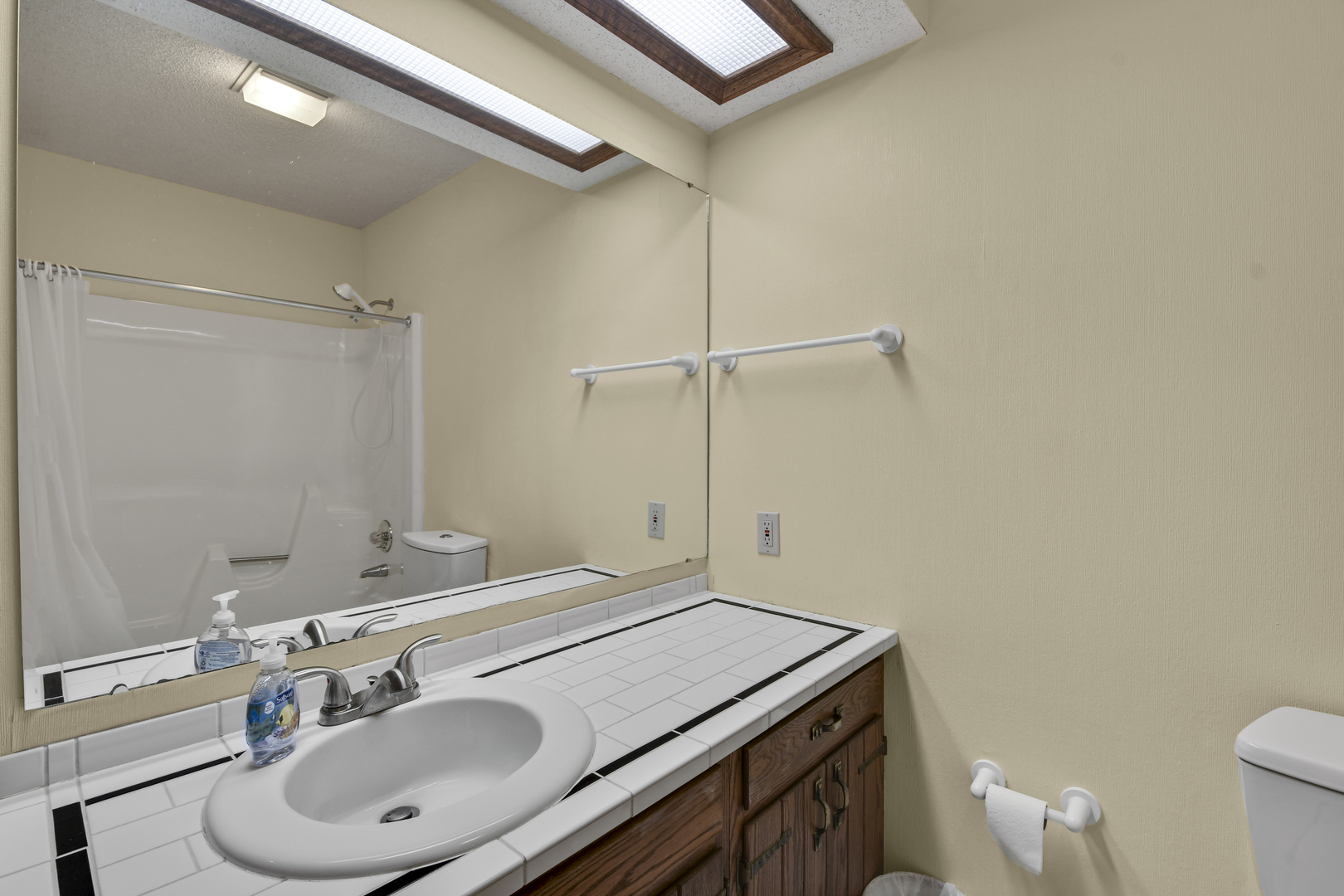 212 Spring Circle, Unit 212 Urbana, IL 61802 - Photo 9 of 22 a bathroom with a sink and a mirror