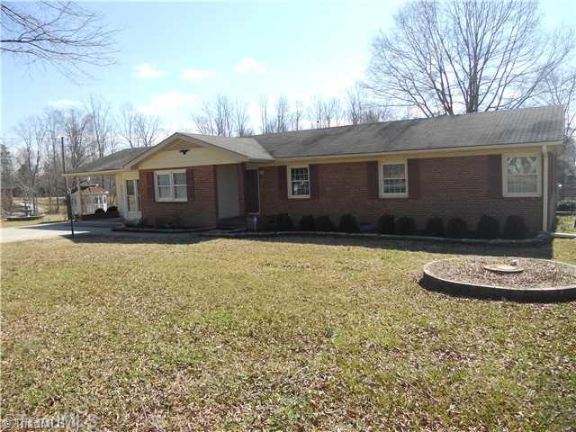 8465 Stafford Mill Road Oak Ridge, NC 27310 - Photo 1 of 16 Exterior Front.