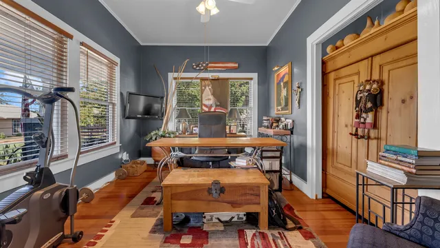 a room with furniture and large windows