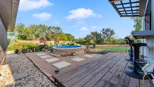 a view of a chairs and table on the wooden floor