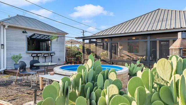 a view of front of house with outdoor seating