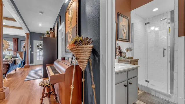 a living room with furniture and a wooden floor