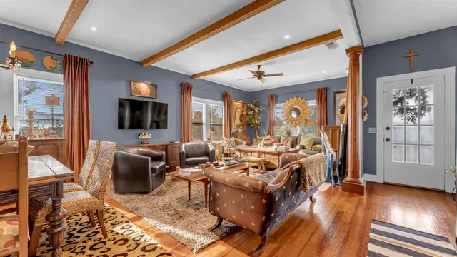 a living room with fireplace furniture and a flat screen tv