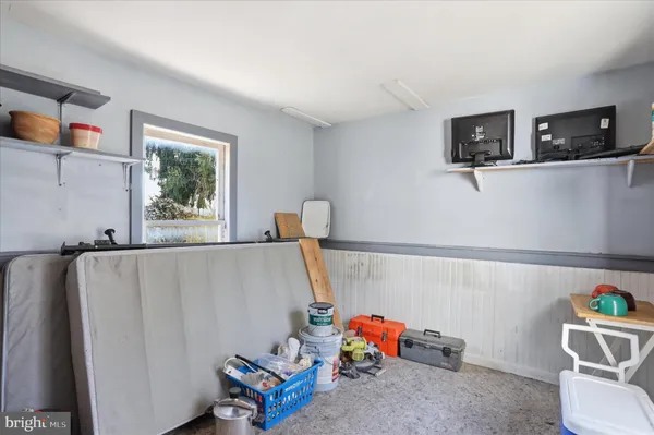 a bathroom with a sink and a refrigerator